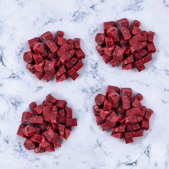 diced beef on marble background 