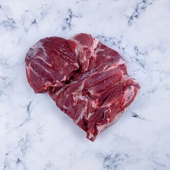 butterflied lamb leg on marble background