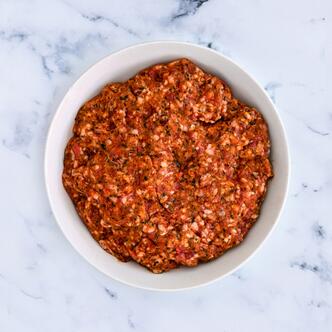 spicy minced lamb kofta on marble 
