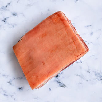 chopped pork belly flat on a marble background 