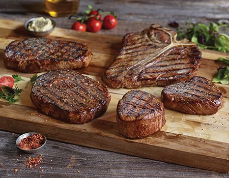 Various Steak Cuts on Cutting Board