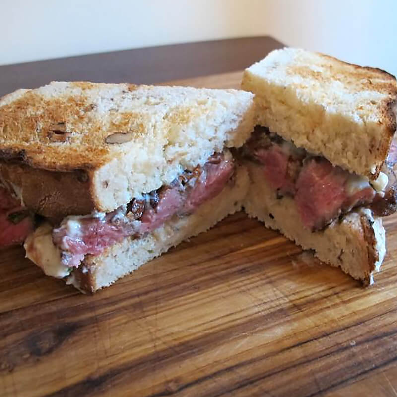 Cabernet-Balsamic Black Mission Fig-Glazed Walnut Toast Ribeye Sandwiches with Creamy Stilton Spread